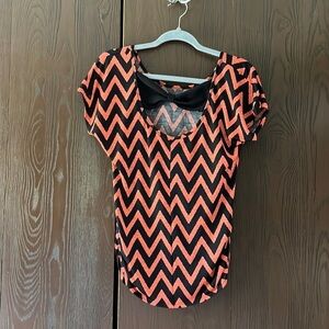 NA orange/ black top. Black bow in the back. Size Medium